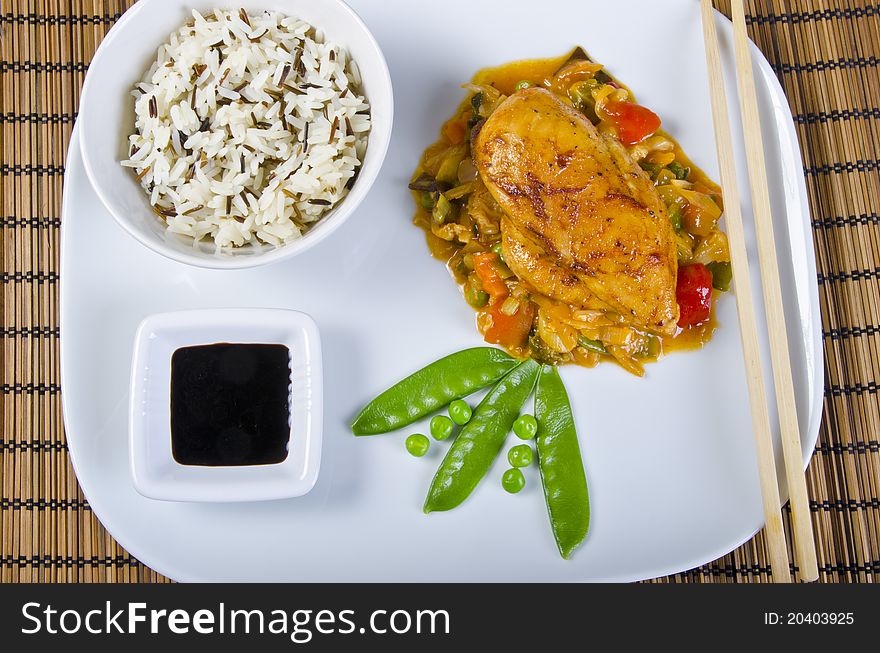 Chickens with vegetables, rice and soy sauce. Chickens with vegetables, rice and soy sauce