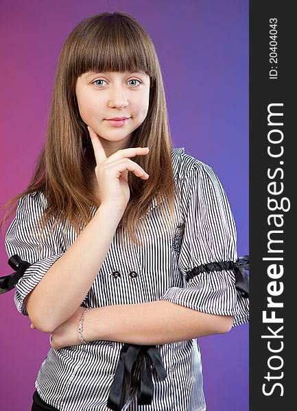 Portrait of happy girl teenager in studio