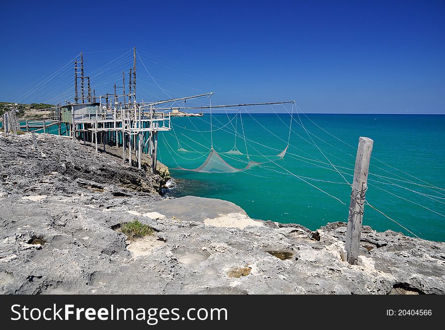 Trabucco is an old fishing machine typical of the coast of Gargano in the Apulia region of southeast Italy. It is protected as historical monument. Trabucco is an old fishing machine typical of the coast of Gargano in the Apulia region of southeast Italy. It is protected as historical monument.