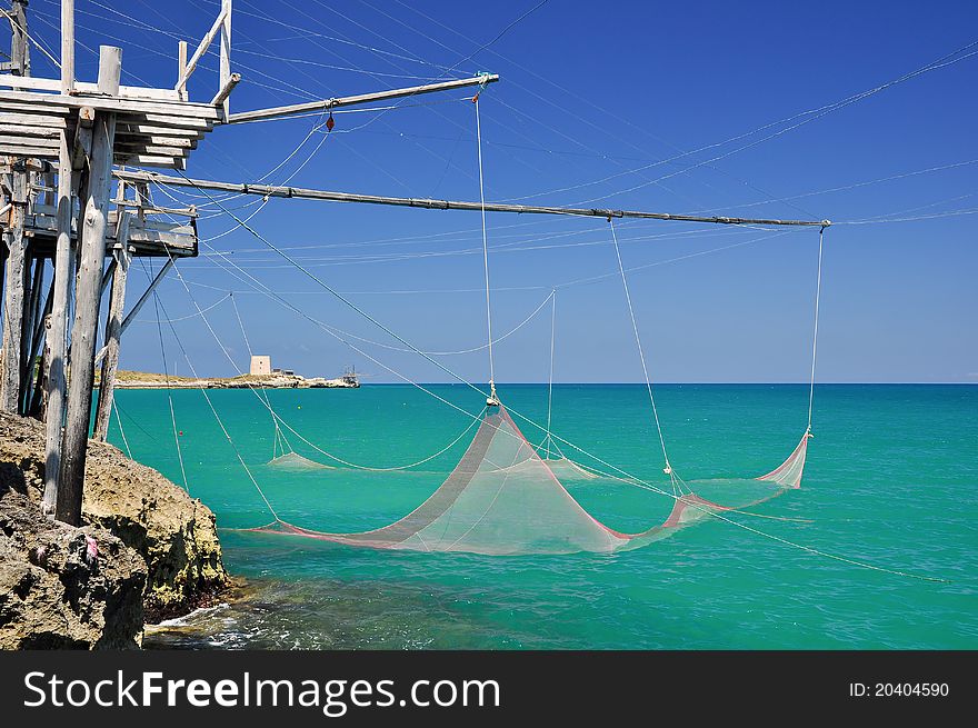 Trabucco is an old fishing machine typical of the coast of Gargano in the Apulia region of southeast Italy. It is protected as historical monument. Trabucco is an old fishing machine typical of the coast of Gargano in the Apulia region of southeast Italy. It is protected as historical monument.
