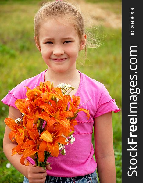 Girl with a bouquet of orange lilies. Girl with a bouquet of orange lilies