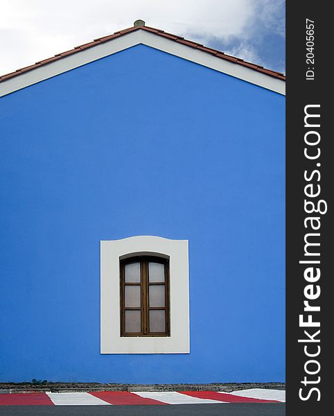 Simple blue house with a window