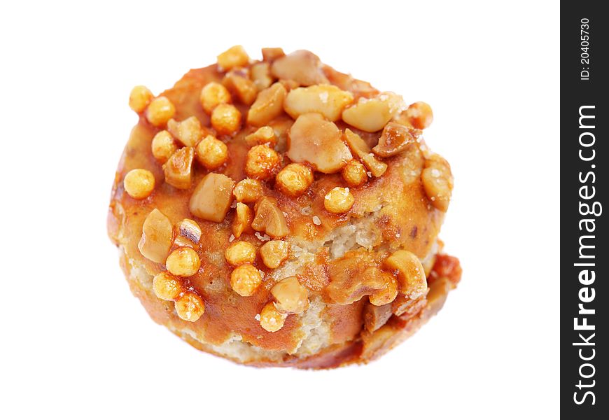 Close up of a coated peanut cookie isolated on white background.