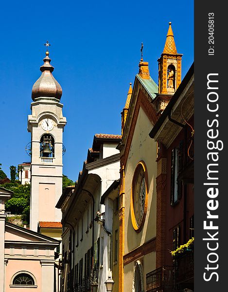 View of Church bell tower in Menaggio, on the shore of lake Como, Italy