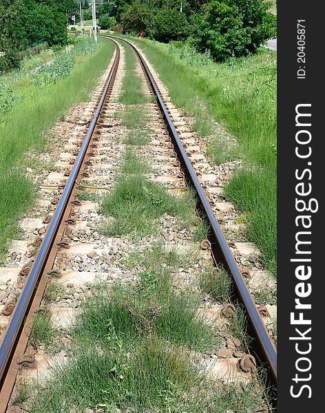 Railroad tracks with grass in Piedmont