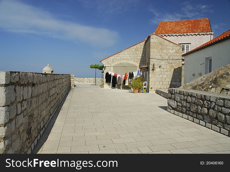 Walk way along the top of the city walls surrounding Dubrovnik. Walk way along the top of the city walls surrounding Dubrovnik.