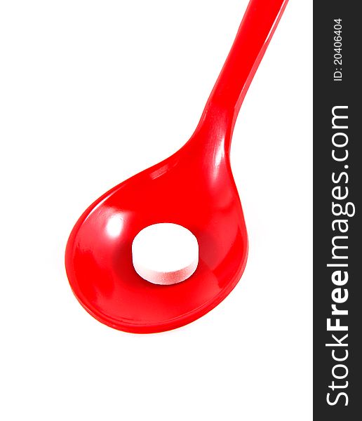 A Medicine On Red Spoon Isolated