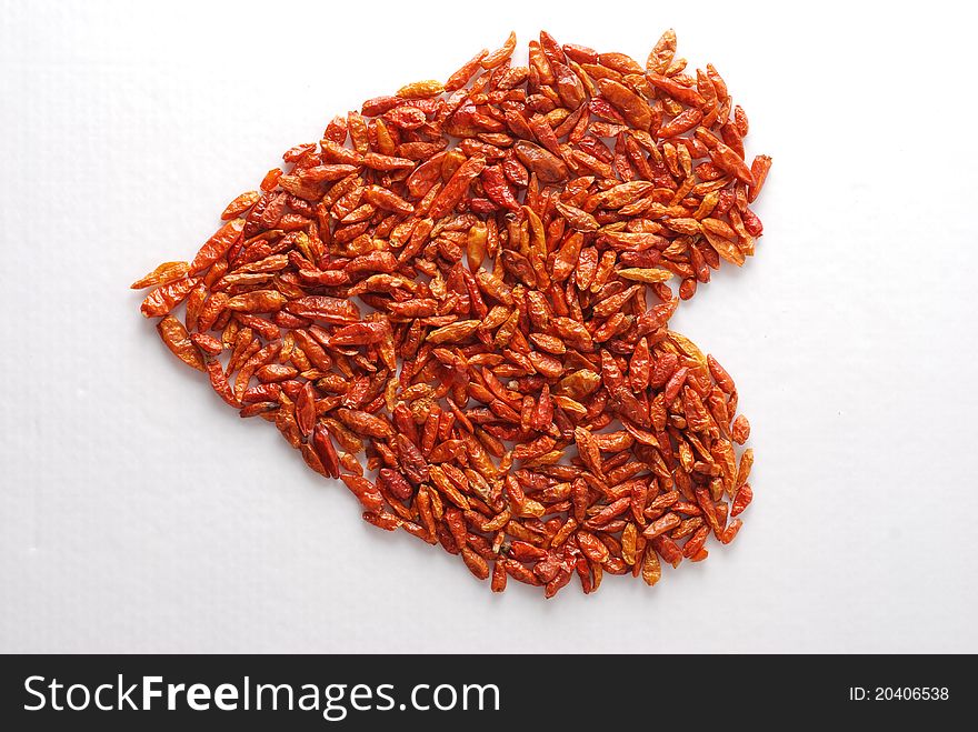 Heart-shaped peppers on a white background