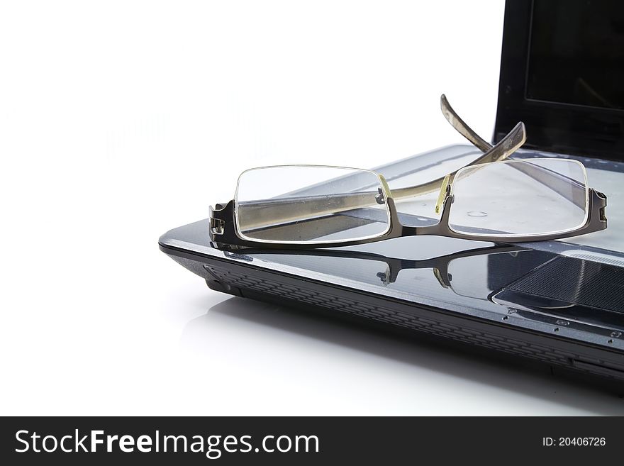 Glasses on computer isolated on white background. Glasses on computer isolated on white background