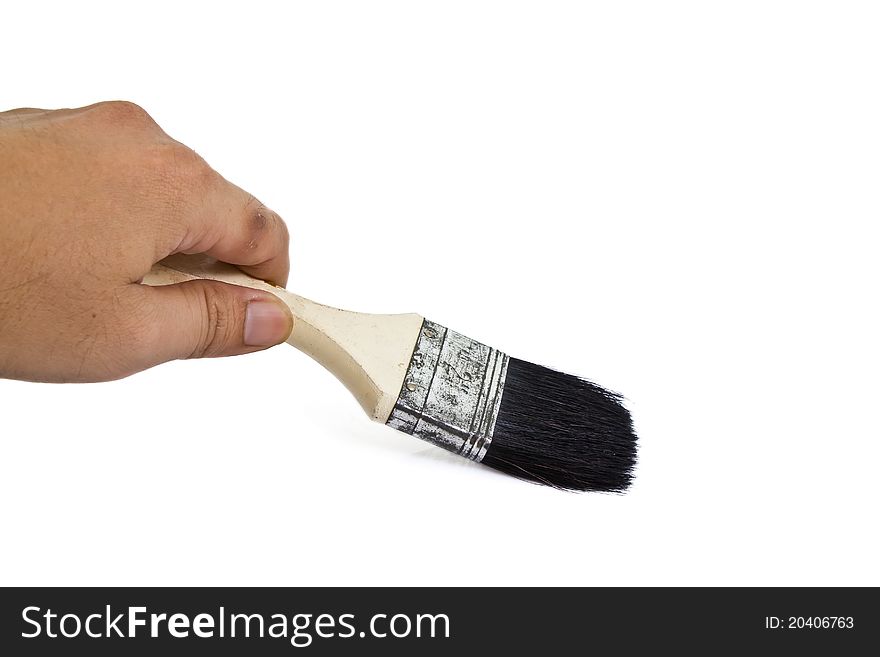 Paintbrush in hand isolated on white background