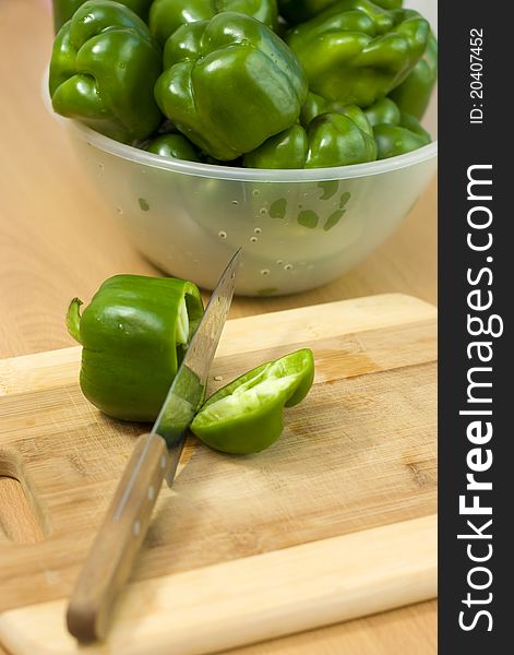 Green pepper cut with a knife. Green pepper cut with a knife.