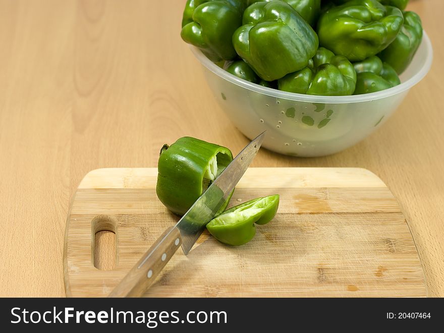 Green pepper cut with a knife. Green pepper cut with a knife.