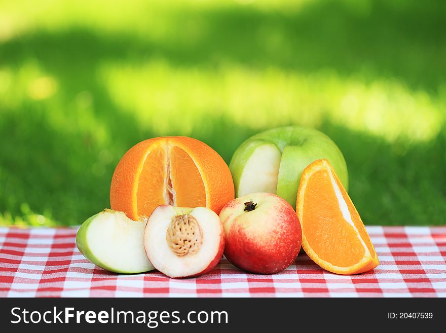 Fresh fruits on the table in the summer garden