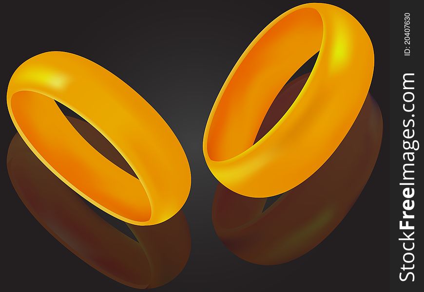 Wedding rings a symbol of love on a background with reflection in a