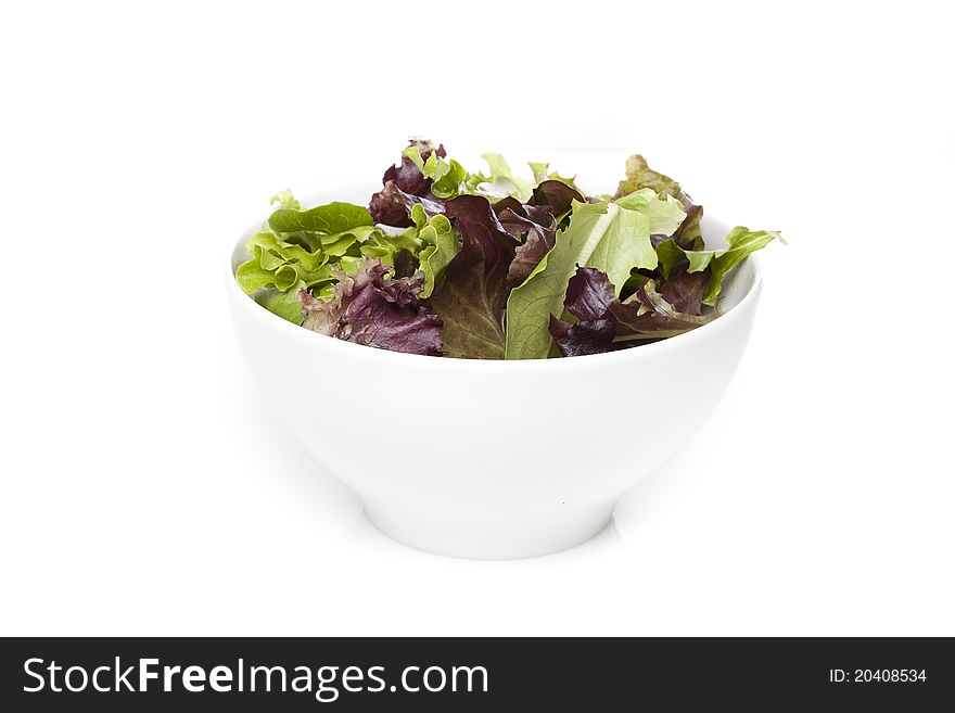 A fresh green salad against a white background