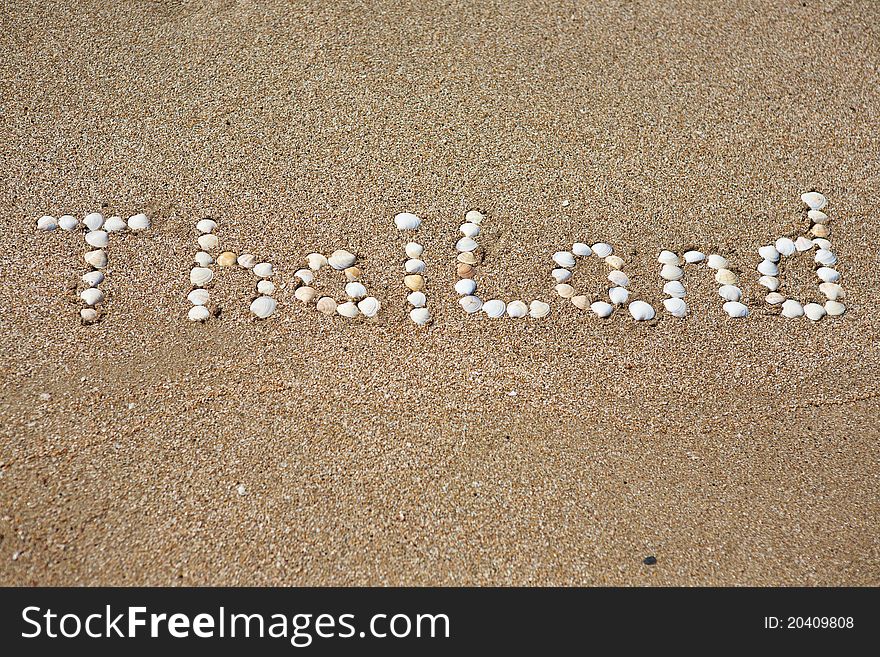 Thailand, seashells written on the sand. Thailand, seashells written on the sand
