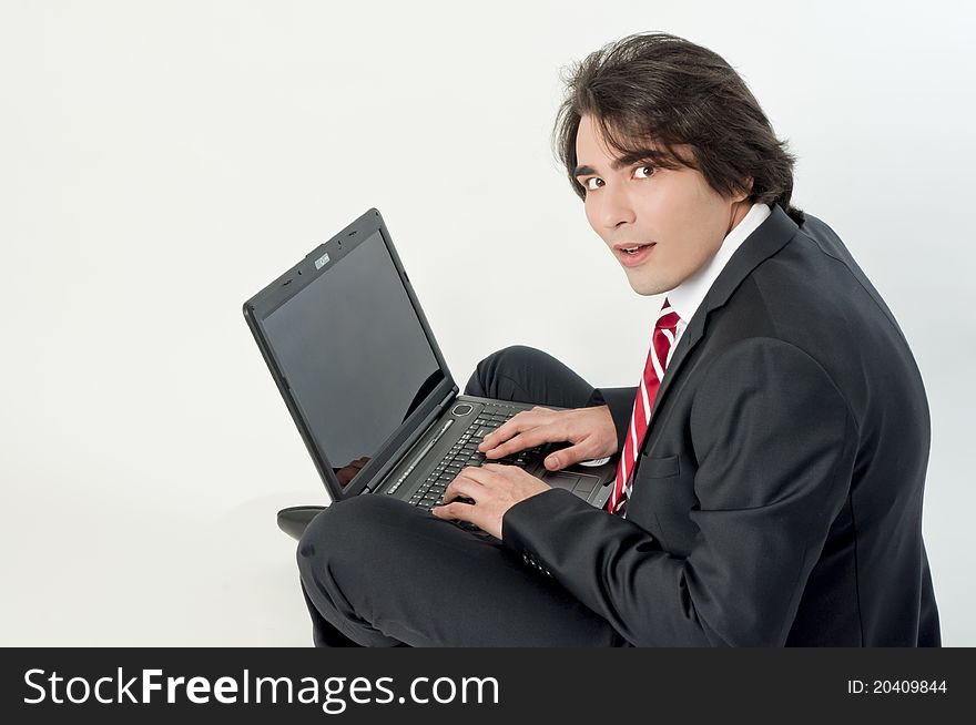 Young man browsing on a notebook. Young man browsing on a notebook