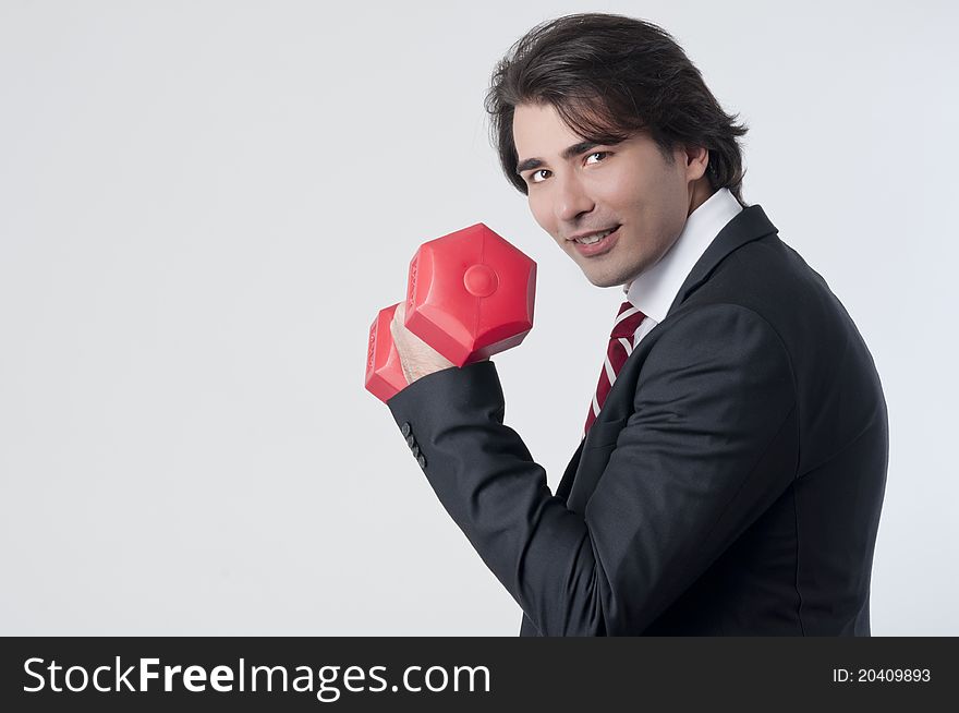 Businessman training with a weightlifting. Businessman training with a weightlifting