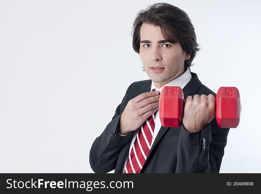 Businessman training with a weightlifting. Businessman training with a weightlifting