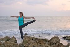 Woman Doing Yoga Exercise At  Beach Royalty Free Stock Photo