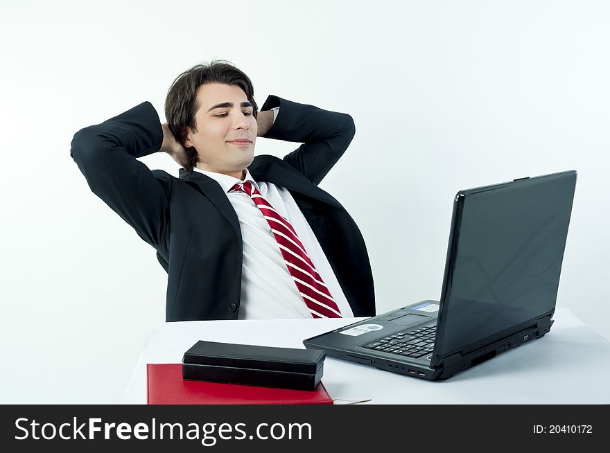 Man taking notes from a laptop on a white background. Man taking notes from a laptop on a white background