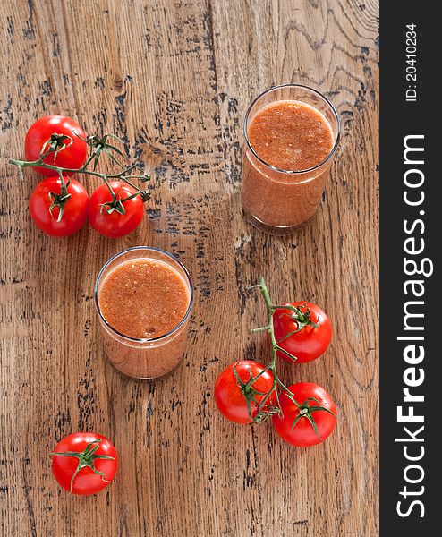 Gazpacho in the glasses with bunch tomatoes