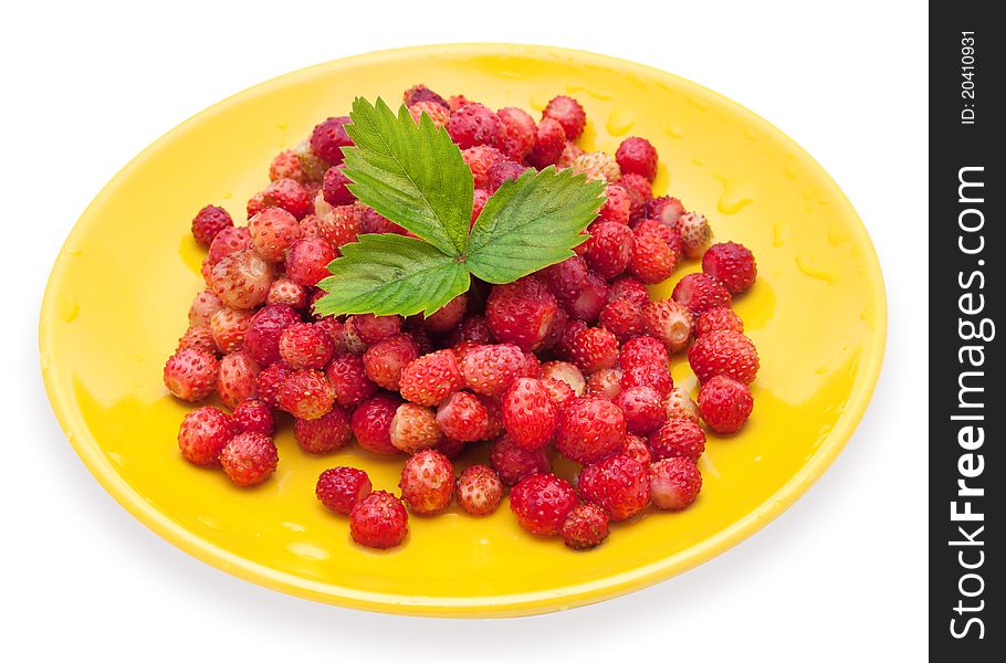 Strawberries on a yellow  plate with green leaf. Strawberries on a yellow  plate with green leaf