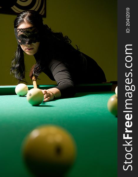 Woman in black veil plays billiards. Woman in black veil plays billiards