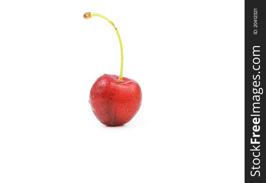 An organic cherry on white background