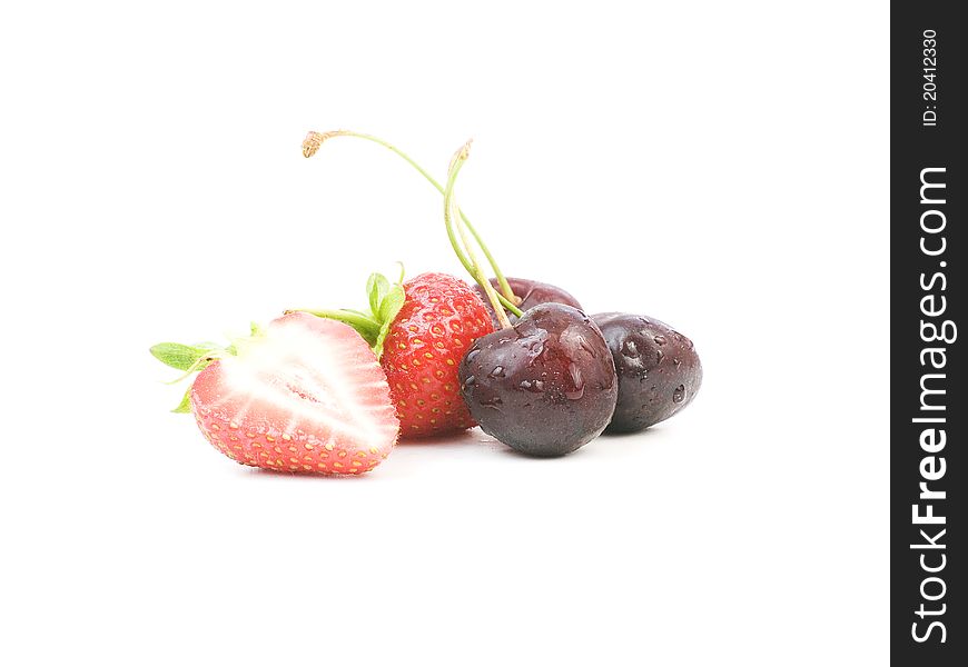 Strawberries and cherries on white background. Strawberries and cherries on white background