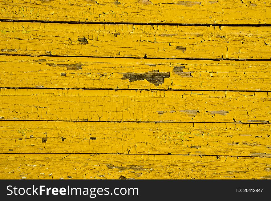 Old yellow wooden wall background and texture