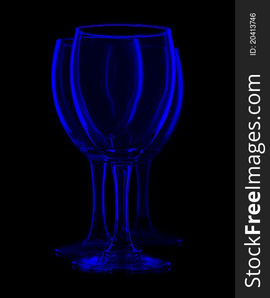 Three empty wine glasses, isolated on black. Three empty wine glasses, isolated on black