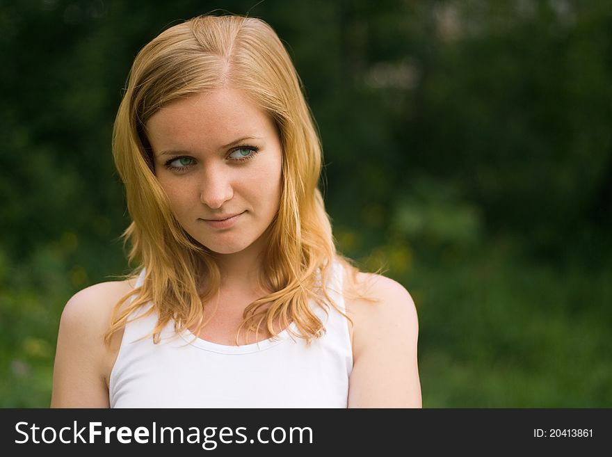 Portrait of pretty girl relaxing in park. Portrait of pretty girl relaxing in park