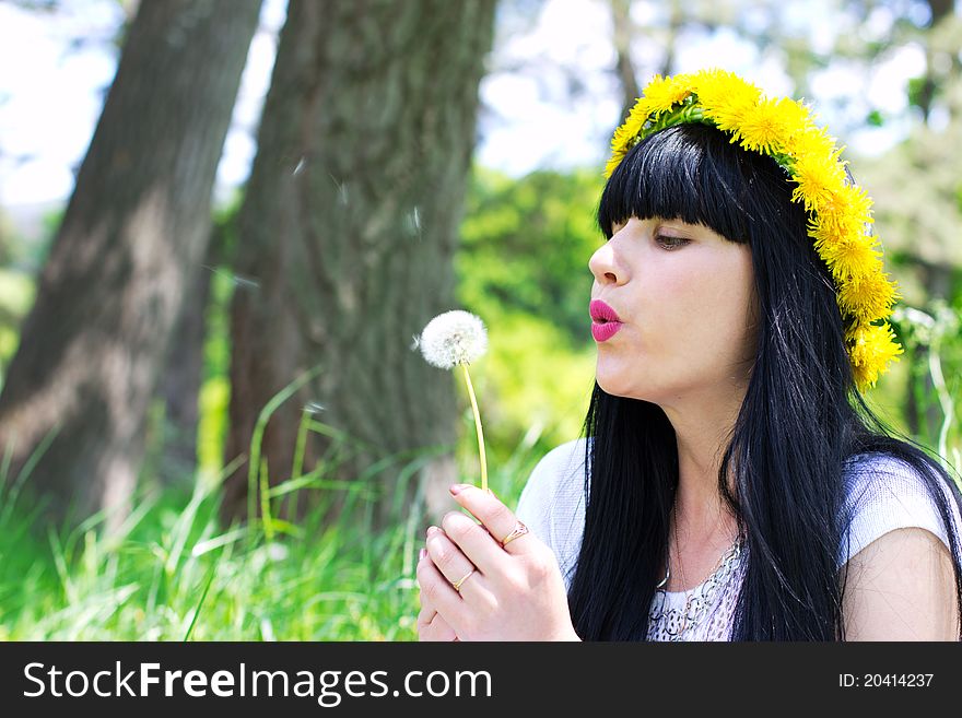 Beautiful woman with dandelion outdoor. Beautiful woman with dandelion outdoor