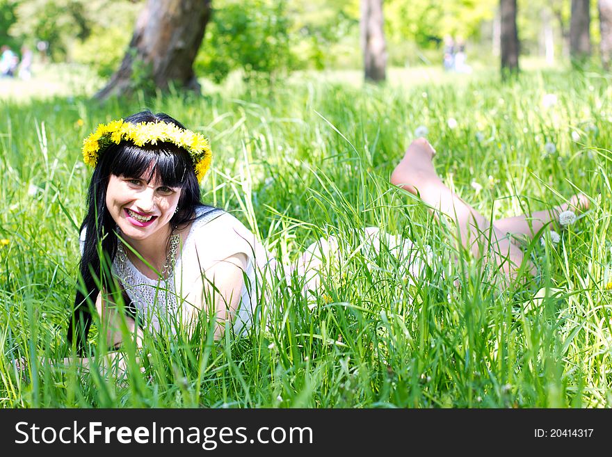 Beautiful woman lying on the grass. Beautiful woman lying on the grass