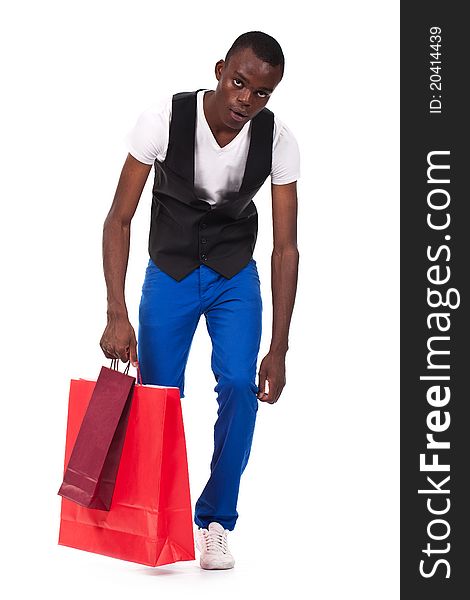 Beautiful black man holding shopping bags and feeling tired