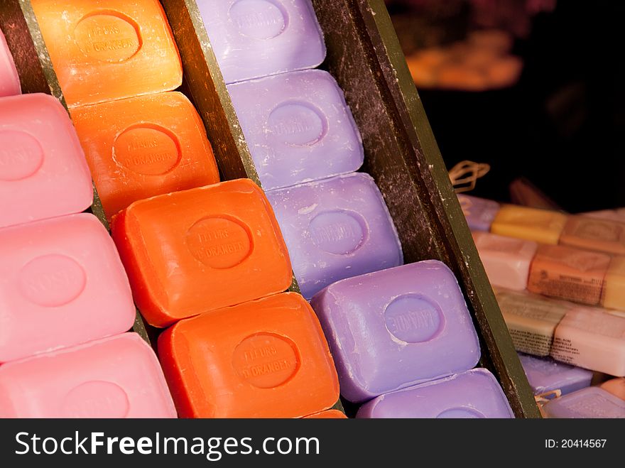 Many different colorful soap bars in old wooden box in the Nice Market. France province. Many different colorful soap bars in old wooden box in the Nice Market. France province.