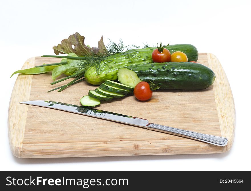 Fresh cut cucumbers with other vegetables. Fresh cut cucumbers with other vegetables