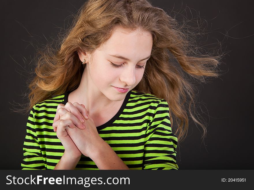 Portrait of happy girl teenager in studio