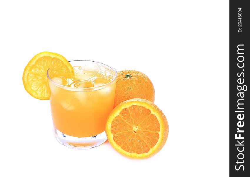 Glass of orange juice with oranges