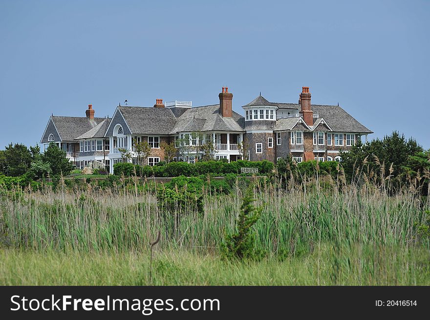 A shot of a summer mansion by the beach. A shot of a summer mansion by the beach