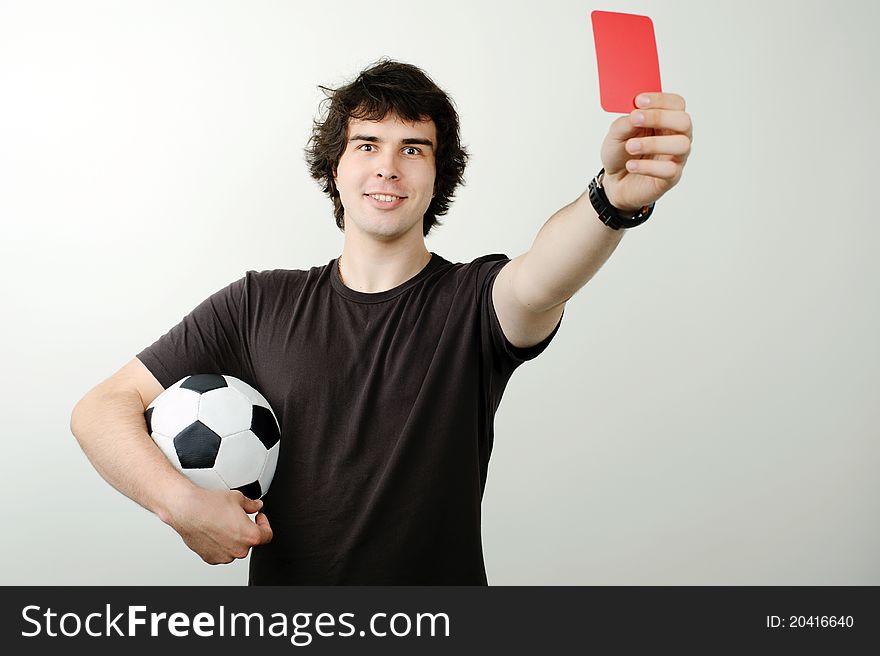 An image of a referee showing red card
