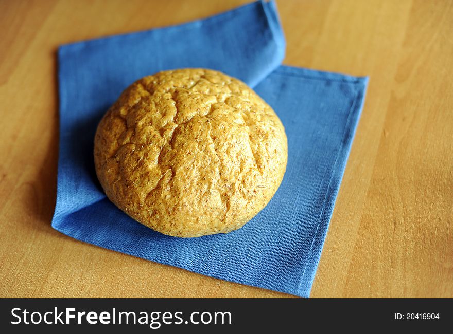 An image of a loaf of fresh bread on a napkin
