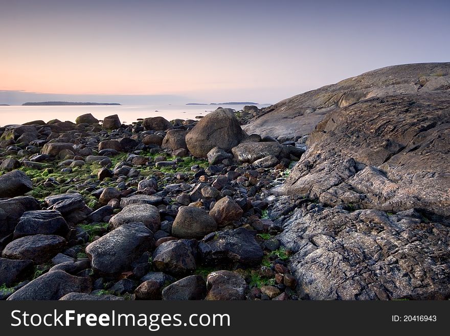 Summer morning in the rocky beach of Uutela, Finland