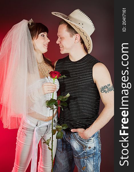 bride and groom in cowboy hat with tattoo
