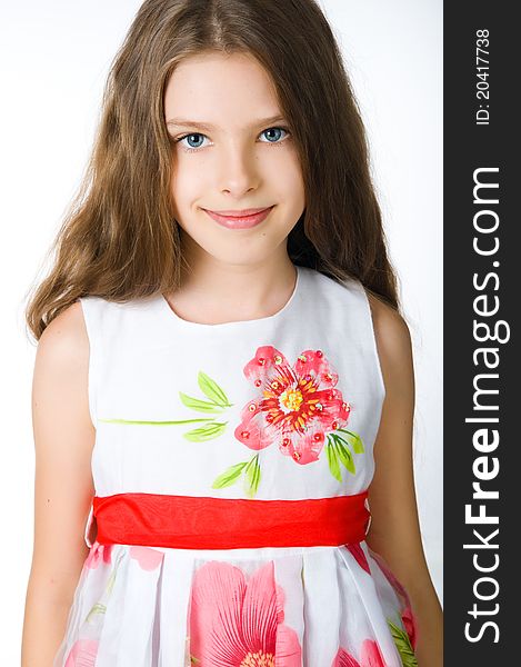 Little girl in red dress on white background