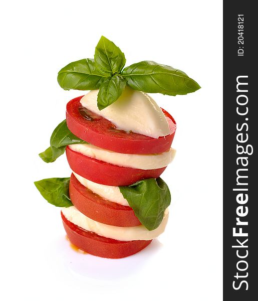 Mozzarella tomatoes basil on a white background