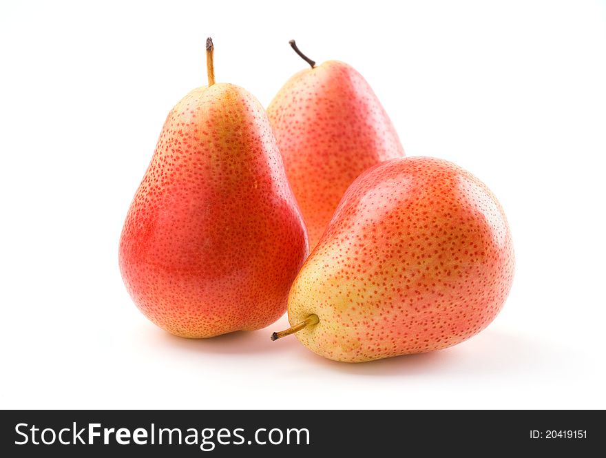 Three fresh pears on white