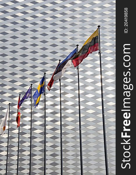 Various flags on modern architecture metal wall background. Various flags on modern architecture metal wall background