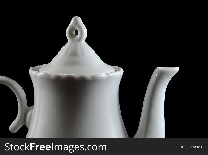 Detail of a white teapot made of porcelain. Detail of a white teapot made of porcelain